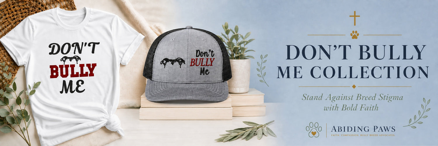 A pitbull wearing a 'Don't Bully Me' bandana sits beside a person in a matching hat and t-shirt, set in a modern outdoor setting, promoting strength, positivity, and love for bully breeds.