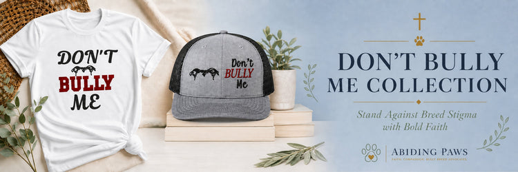 A pitbull wearing a 'Don't Bully Me' bandana sits beside a person in a matching hat and t-shirt, set in a modern outdoor setting, promoting strength, positivity, and love for bully breeds.