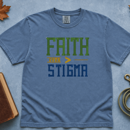 Faith Over Stigma Comfort Colors Tee in Blue Jean flatlay with Holy Bible and dog leash on blue background with autumn leaves