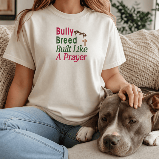 Woman wearing Bully Breed Built Like A Prayer tee in Ivory with bully breed dog