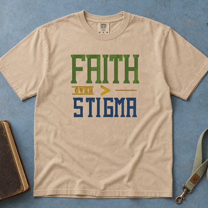Faith Over Stigma Comfort Colors Tee in Sandstone flatlay with Holy Bible and dog leash on blue background with autumn leaves