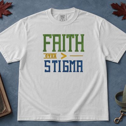 Faith Over Stigma Comfort Colors Tee in White flatlay with dog leash on blue background with autumn leaves