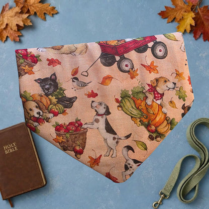 Reverse side of dog bandana with dogs, pumpkins, wagon and autumn leaves
